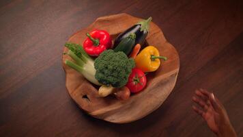 A Vibrant Array of Colorful Fresh Vegetables Artistically Arranged in a Wooden Bowl video