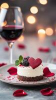 Romantic dessert with heart shaped cake and wine on a table decorated with rose petals photo