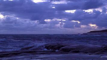 Storm waves crashing rocks coast. Dramatic skies in the evening video