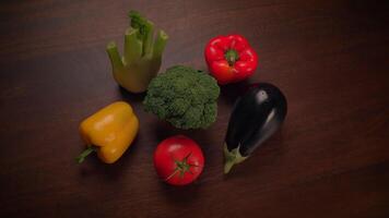 A Colorful Assortment of Fresh Vegetables Beautifully Arranged on a Wooden Table Surface video