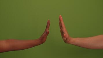 Hands Reaching Out Against a Vibrant Green Background That Encapsulates Community and Unity video