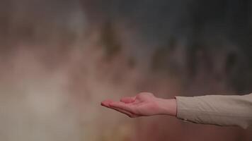 A Hand Gesture Presented Against a Beautiful and Colorful Background That Captures Attention video