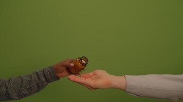 A Hand Extended in Offering Beautifully Displayed Against a Lively Green Background Setting video