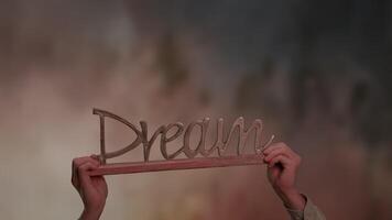 An inspiring message about the concept of Dream set against a soft, soothing background video