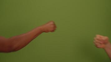 A strong fist against a green background symbolizes determination, power, and unity in activism video