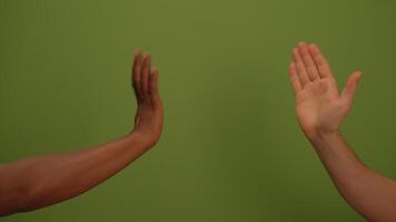 Hands Reaching Out on a Calm and Inviting Green Background Emphasizing Connection and Community video