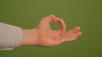 A hand gesture that makes an OK sign while also showcasing a stylish ring accessory video