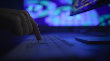 Fingers Rapidly Typing on a Keyboard Against a Bright Neon Background Displaying Colorful Lights video