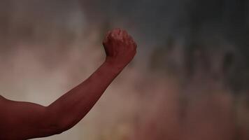 An Energetic Fist Gesture Set Against a Dramatic and Strikingly Colorful Background video