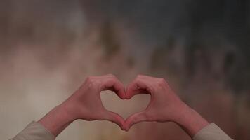 HeartShaped Hands Positioned Gently Against a Soft and Ultra Dreamy Background Scene video