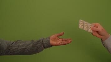 An Outstretched Hand Against a Bright Green Background Evokes Connection and Emotion video