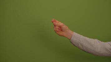 An Image Featuring Hand Gesture Displayed on a Vibrant Green Background for Artistic Purposes video