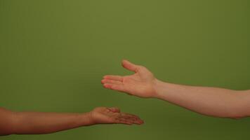 An Outstretched Hand Set Against a Vibrant Green Background Creates a Visually Impactful Scene video