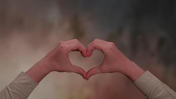 HeartShaped Hands Positioned Gently Against a Soft and Ultra Dreamy Background Scene video