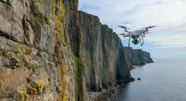 Drone exploration of majestic coastal cliffs on a clear day photo