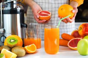 Healthy and delicious multivitamin fresh fruit juice in a glass on the table. Healthy food concept. Close-up. Selective focus. photo
