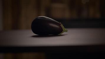 A Beautiful Fresh Eggplant Beautifully Arranged on a Rustic Wooden Table in a Bright Setting video