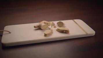 Freshly cut Ginger placed beautifully on a Cutting Board for culinary use in meals video