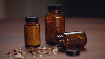 A Variety of Assorted Capsules and Bottles of Dietary Supplements Placed on a Wooden Surface video