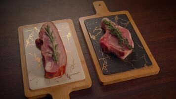 Artfully arranged and plated meats garnished with an assortment of fresh, fragrant herbs video