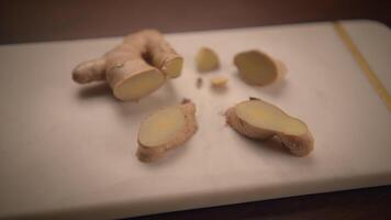 Fresh Ginger Root Slices Beautifully Arranged on a Wooden Cutting Board for Cooking video