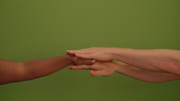 This artwork features a hand gesture displayed prominently on an eyecatching green background video