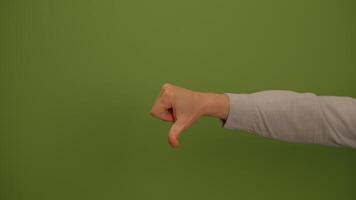 A Thumbs Down Gesture Displayed on a Bright Green Background for Visual Representation video