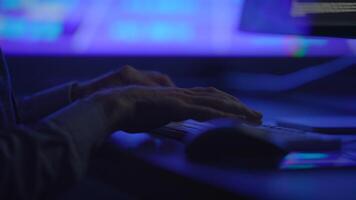 CloseUp of Hands on a Keyboard in a Dark Tech Environment Surrounded by Digital Sensations video