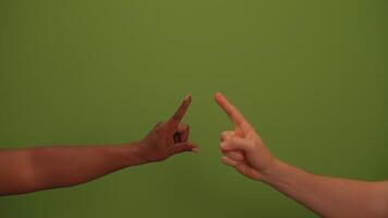 Hands Pointing Together on a Vibrant Green Background Displaying Unity and Collaboration video