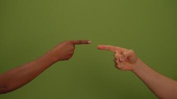 Two hands point towards each other on a vibrant green background, symbolizing connection video