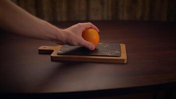 An Elegant Wooden Cutting Board Complimented by a Slate Surface Placed on a Dark Table video