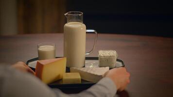 A variety of fresh dairy products are beautifully arranged on a table for everyone to enjoy video