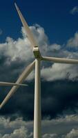 A Wind Turbine Standing Majestically Against a Backdrop of Dramatic, Dark Clouds Above video