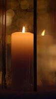 The warm glow of a flickering candle illuminated the inside of a beautiful lantern video