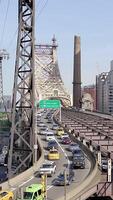 A beautiful view of urban traffic on a bridge set in a bustling cityscape during daytime video