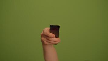 Elegant hand gesture on a vivid green background, showcasing creativity and expression video