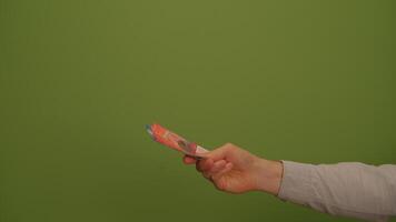 A vibrant green background featuring a pair of scissors, symbolizing creativity and craft video