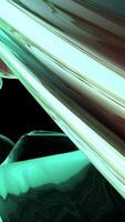 This artwork features an abstract wooden surface which is enhanced by a vibrant neon glow video