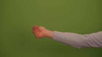 A Hand Gesture Displayed Against a Bright Green Background, Symbolizing Communication and Emotion video