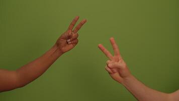 A peace sign against a calming green background conveys tranquility and connection video
