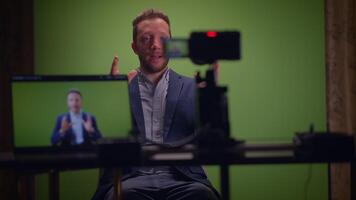 A Professional Speaker Utilizing a Green Screen Setup for HighQuality Production video