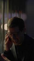 A Cheerful and Excited Man Engaged in a Phone Conversation in a Dynamic Urban Environment video