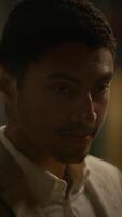 A man in a suit shows a focused expression, reflecting a profound state of contemplation video