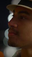 A captivating portrait of a young man captured in a vibrant and modern urban setting video