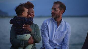 Portrait of a happy Interracial Family enjoying life together outside in the park video