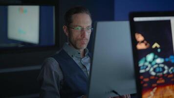 A Focused and Dedicated Professional Specializing in Analyzing Data in a Modern Office Setting video