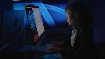 A Focused Professional Diligently Analyzing Data on a Computer Screen in an Office Environment video