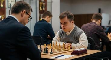 Intense chess match in diverse tournament setting photo