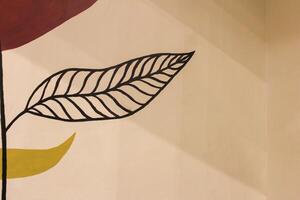 Abstract Leaf with Black Lines and Shadow on Wall photo