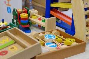 A vibrant array of wooden toys designed to enhance children's learning through play, promoting creativity and cognitive development. photo